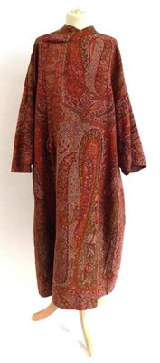Lot 2083 - Coat fashioned from a 19th Century Woven Paisley Shawl, woven in shades of olive green, red and...