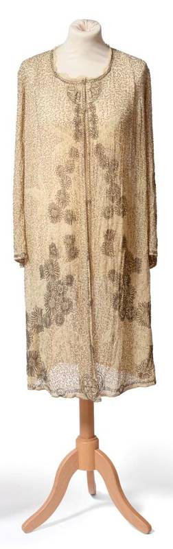 Lot 2095 - 1920's Cream Cotton Gauze Long Sleeved Coat, densely beaded with flowers in dull gold coloured...