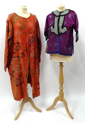 Lot 2096 - 1920's Tomato Red Silk Coat, the fabric woven in a floral design in various colours, likely...