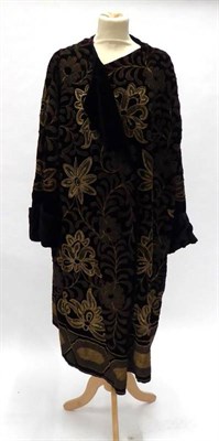 Lot 2103 - 1920's Black Velvet Evening Coat, with side fastening, long sleeves with turned back cuffs, the...