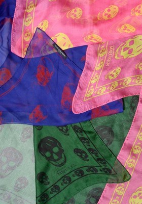 Lot 2173 - Three Alexander McQueen Silk 'Skull' Scarves, in pink/yellow, green/black and blue/red (3)