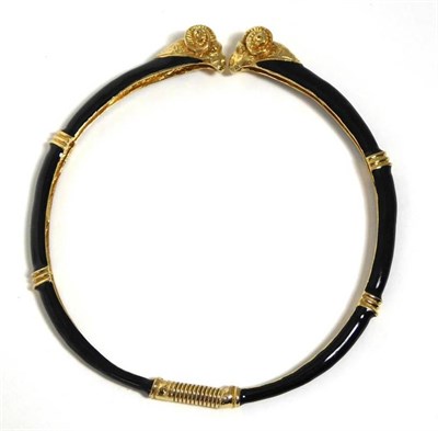 Lot 2181 - A Gilt Metal and Black Enamel Collar Necklace, by Donald Stannard, modelled as two gilt ram's heads