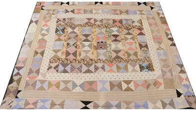 Lot 2012 - Early 20th Century Double Sided Patchwork Quilt, incorporating floral and geometric patterned...