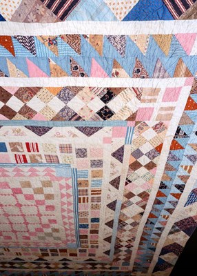 Lot 2017 - Mid 19th Century Patchwork Quilt, worked in frames with a central square, patched with pink and...