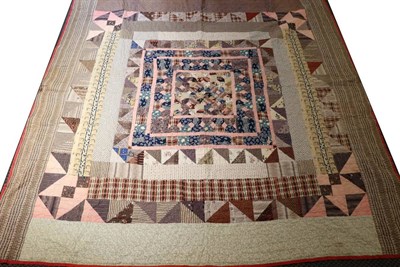 Lot 2026 - 19th Century Large Reversible Patchwork Quilt, incorporating early 20th century printed cotton...