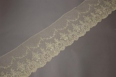 Lot 2064 - Two 19th Century Brussels Lace Applique Flounces, worked on machine net, decorated with swags...