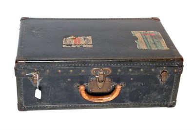 Lot 2082 - An Early 20th Century Louis Vuitton Suitcase, mounted with black canvas and black painted trim,...