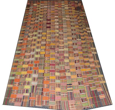 Lot 2094 - Early 20th Century Ghanian Kente Cloth, incorporating strips of striped and geometric designs...