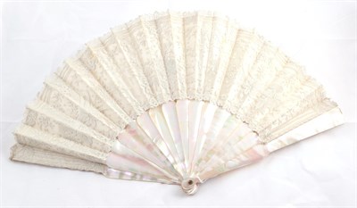 Lot 2099 - Circa 1880-1900 Brussels Lace Fan, on pink mother of pearl sticks and guards, lace leaf is...