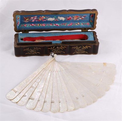 Lot 2108 - A 19th Century Chinese Mother of Pearl BrisÅ½ Fan, with 19 sticks and two guards carved with scenes