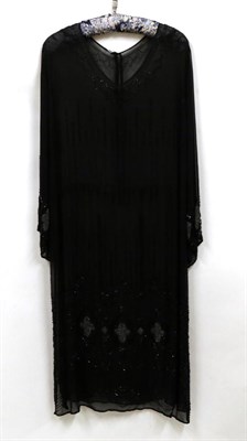 Lot 2126 - Circa 1918 Silk Georgette Gown, with flared sleeves and heavily beaded hem