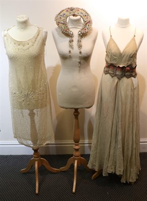 Lot 2130 - Circa 1920s  Ivory Silk Chiffon Drop Waist Dress, with crystal and pearl bead decoration (af);...