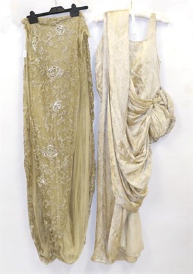 Lot 2138 - Edwardian Silk Lame Brocade Gown, with a long weighted train, and a bow to the hip embellished with