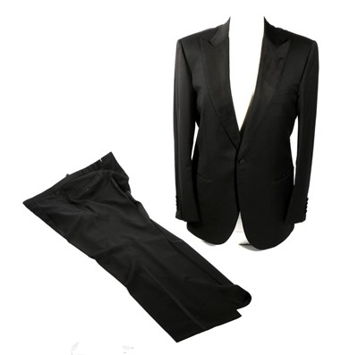 Lot 2142 - A Rare Brioni for James Bond Black Dinner Jacket and Trousers, with silvered lining woven with...