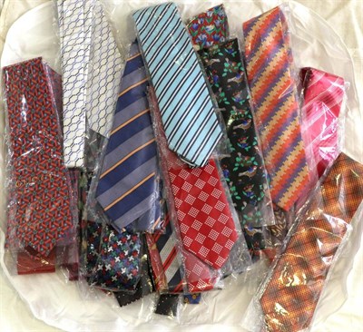 Lot 2145 - Thirty Two Mens Designer Silk Ties, in flamboyant colours and designs, including brands such as...