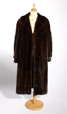 Lot 2154 - Dark Mink Fur Coat, with cuffed sleeves, side pockets, floral woven lining, and a modern...