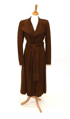 Lot 2220 - Yves Saint Laurent Brown Suede Leather Belted Long Jacket, with lapel collar and lined in brown...