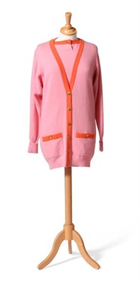 Lot 2223 - Chanel Boutique Candy Pink Wool Long Line Cardigan, coral trim to neckline and patch pockets,...