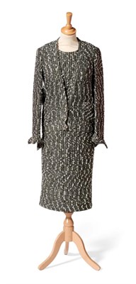 Lot 2237 - Chanel Black and Grey Boucle Two Piece Ensemble, comprising jacket with deep v-neckline fastened by