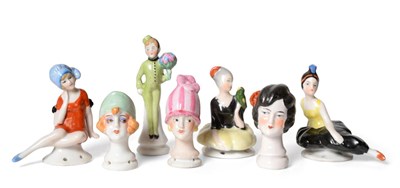 Lot 2004 - Three Miniature China Stylised Busts, modelled in the 'flapper' style with bobbed haircuts and...