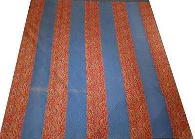 Lot 2041 - 19th Century Turkey Red Paisley Printed Quilt, with blue stripes to the reverse, 205cm by 220cm...