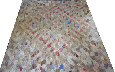 Lot 2044 - A 19th Century Patchwork Quilt, incorporating printed cottons in pinks, browns, blues and creams in