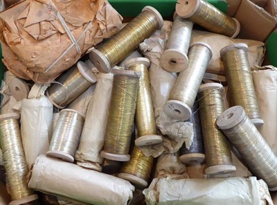 Lot 2052 - Quantity of Silvered and Gold Embroidery Threads, on wooden bobbins, some in original packaging...