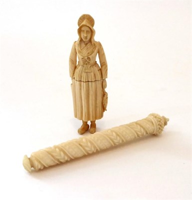 Lot 2063 - 19th Century Dieppe Ivory Needle Case, carved as a fisher woman holding a fish by her side, wearing