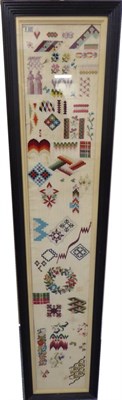 Lot 2101 - Late 19th Century Wool Work Long Sampler, the geometric shapes and patterns, a floral wreath...