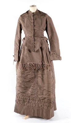 Lot 2115 - Circa 1870/80 Grey Silk Two Piece, comprising a fitted long sleeved jacket, faux buttons to the...