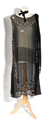 Lot 2136 - Circa 1920s Multicolour Beaded Black Silk Chiffon Dress, embellished with a beaded foliate...