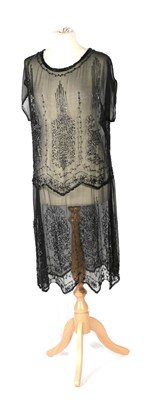 Lot 2137 - Circa 1920s Beaded Black Silk Chiffon Tabard Dress, decorated with black/metallic bugle and...