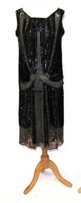 Lot 2140 - Circa 1920s Bead and Sequin Flapper Dress, applied to black net with black sequins, detailing...