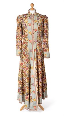 Lot 2141 - Circa 1930/40s Indian Crewelwork Housecoat, densely embroidered allover with a vibrant floral...