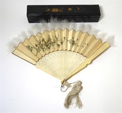 Lot 2239 - A 19th Century Chinese Pierced Ivory Fan, with carved sticks and guards, cream paper mount hand...