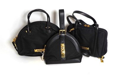 Lot 2243 - Three Modern Moschino Handbags, comprising a brown D-shaped handbag, with twin carry handles...