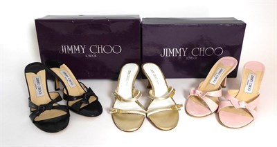 Lot 2251 - Three Pairs of Jimmy Choo Shoes, comprising a pair of champagne, gold and white slip on heeled...