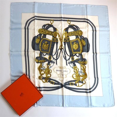 Lot 2263 - Hermè ";Brides de Gala"; Silk Scarf, by Hugo Grygker, printed with a large horse bridle design on