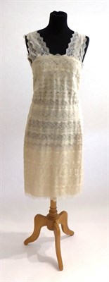 Lot 2267 - Alexander McQueen Cream Lace Bodycon Dress, the cream lace laid in tiers over a nude lining,...