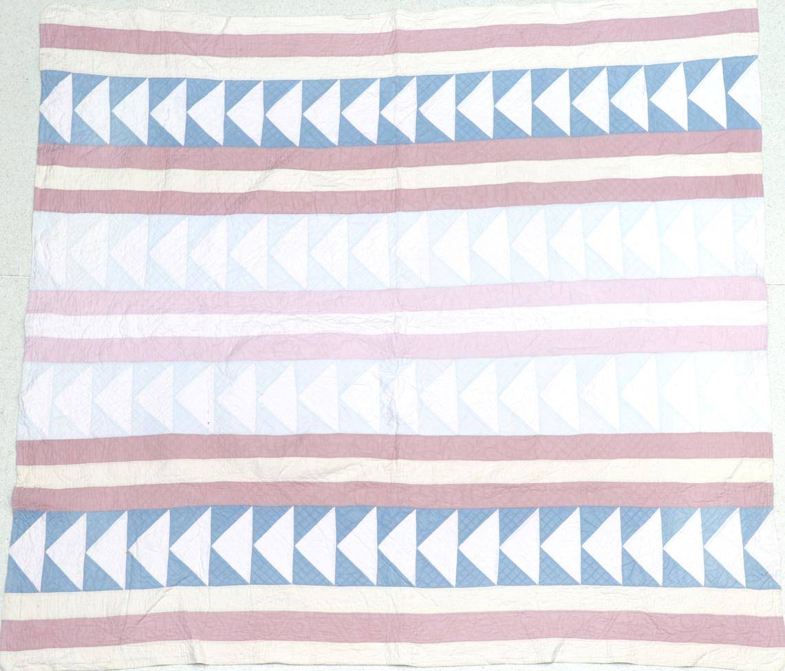 Lot 2042 - Late 19th Century Pink, Blue and Cream Quilt, in stripes and chevrons with pale pink reverse...