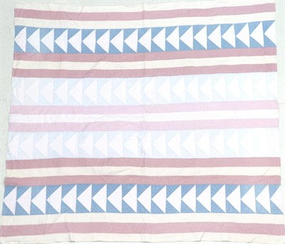 Lot 2042 - Late 19th Century Pink, Blue and Cream Quilt, in stripes and chevrons with pale pink reverse...