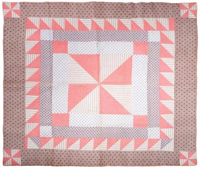 Lot 2054 - A 19th Century Cotton Patchwork Quilt, with a central square formed by pink and striped...