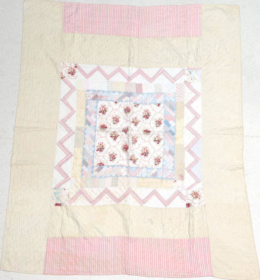 Lot 2055 - Late 19th Century Quilt, with large central square of floral cotton, surrounded by frames of...