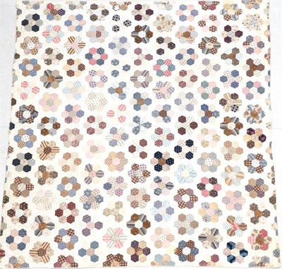 Lot 2068 - A Late 19th Century Cotton Patchwork Quilt, with hexagonal flower head pattern overall, cream...