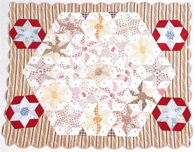 Lot 2069 - A 19th Century Cotton Patchwork Coverlet, decorated with stars within a scalloped edge, 140cm...