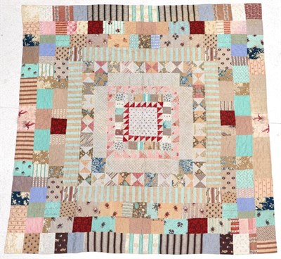 Lot 2073 - A Late 19th Century Patchwork Quilt, comprising a central square surrounded by frames of...