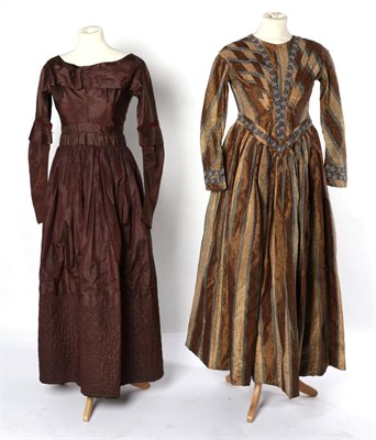 Lot 2115 - Mid 19th Century Brown Silk Dress, with a wide neckline sitting on the shoulders, multi pleated bow