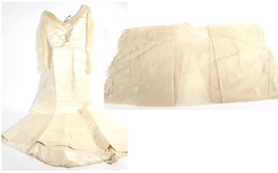 Lot 2125 - Late 19th/Early 20th Century Cream Satin Wedding Dress, with empire style bodice, crepe long...