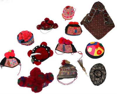 Lot 2189 - Child's Central Asian Hats, including a Kohistan cap embroidered with geometric designs,...