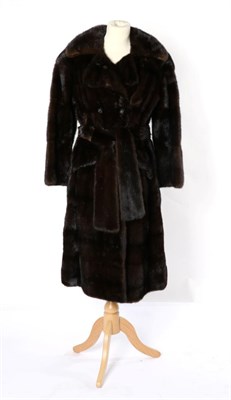 Lot 2225 - A Dark Mink Double Breasted Coat, with front pockets, fur belt